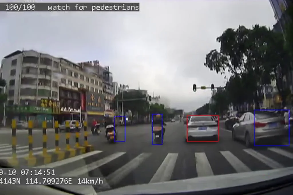 ADAS AI technology identifying vehicles and pedestrians on the road.