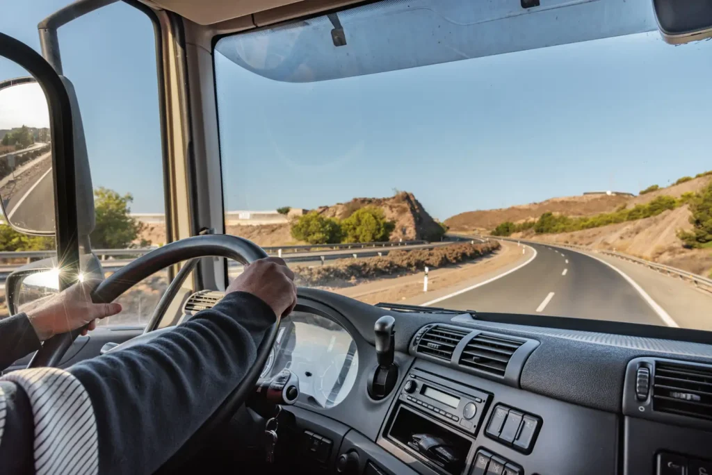 Commercial vehicles traveling in convoy with real-time fleet oversight support.