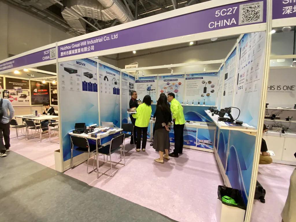 Trade show booth for Huizhou Great-Will Industrial Co. Ltd. with visitors discussing product displays and equipment